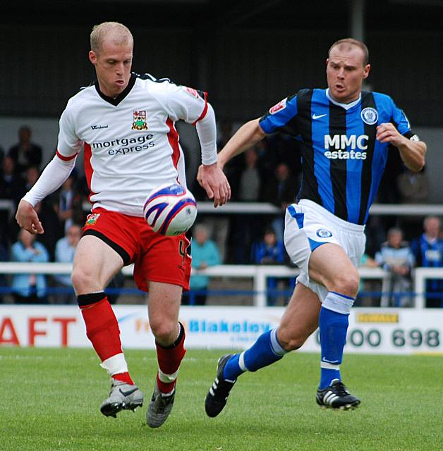 Neal Bishop holds off the challenge of Dale skipper Gary Jones