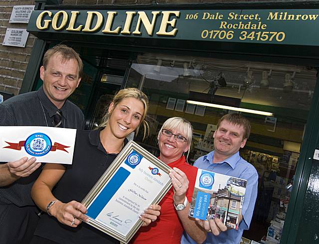 GOLD STAR: Goldline Milnrow staff Emma Kelsey and Joanne Lord (centre) receive their Tidy Business Standards Charter certificate from Rochdale Council’s Gordon Beverley (left) and Tommy Downes (right).