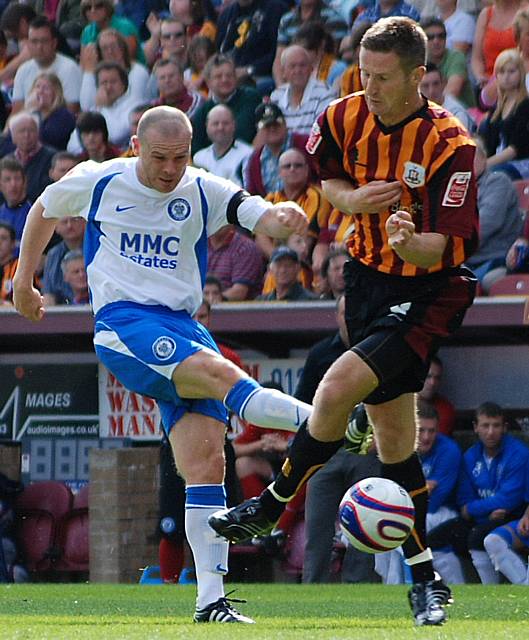 Rochdale skipper Gary Jones fires in a shot