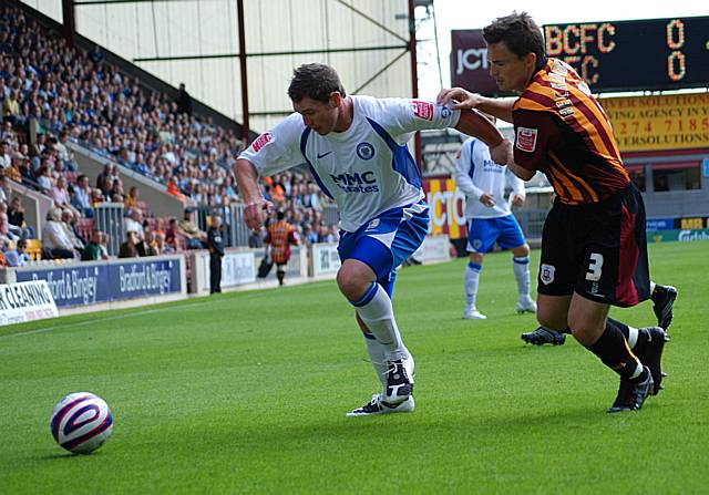 Rochdale debutant Ciaran Toner and Paul Heckingbottom battle for possession