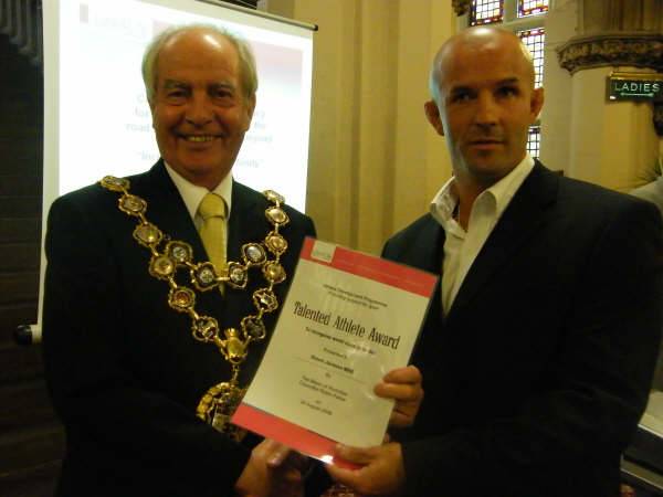 Simon Jackson receives his Award