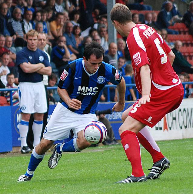 Dagnall looks to get past Ben Futcher