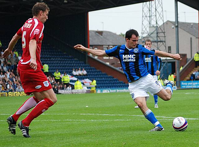 Dagnall looks to get a shot in in front of Futcher