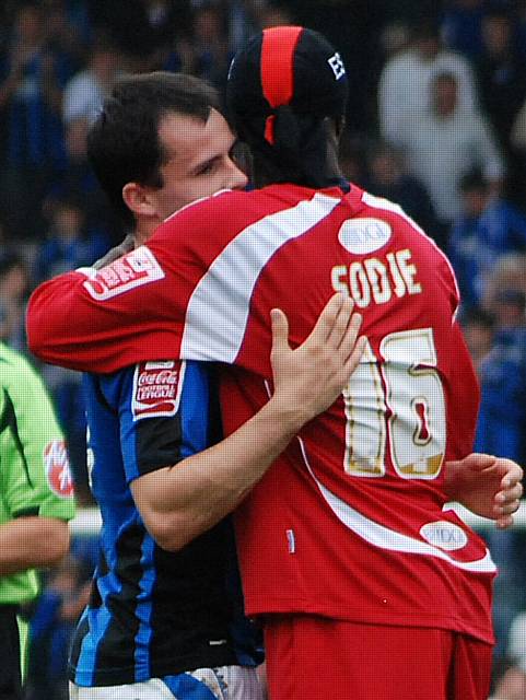 Dagnall and Sodje share a sporting moment after the game after battled against each other throughout the afternoon