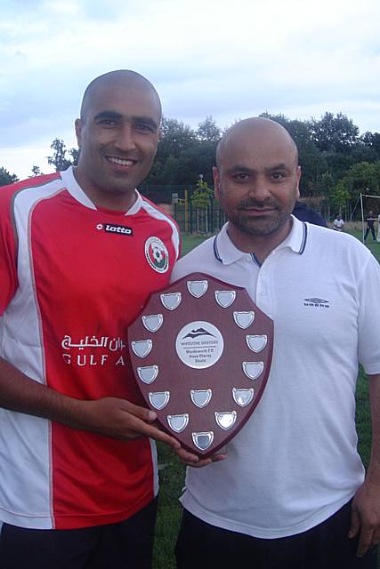 The two team captains line-up ahead of the game