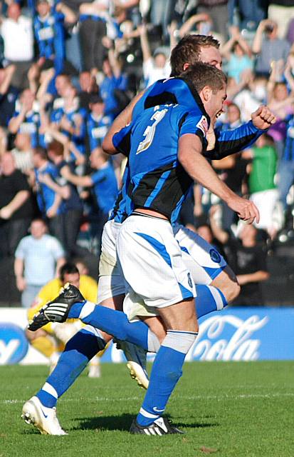 Tom Kennedy wheels away towards the Dale dugout after his 95th minute winner.