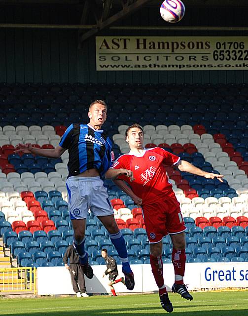 Rhodes and Goodall go up for a header.