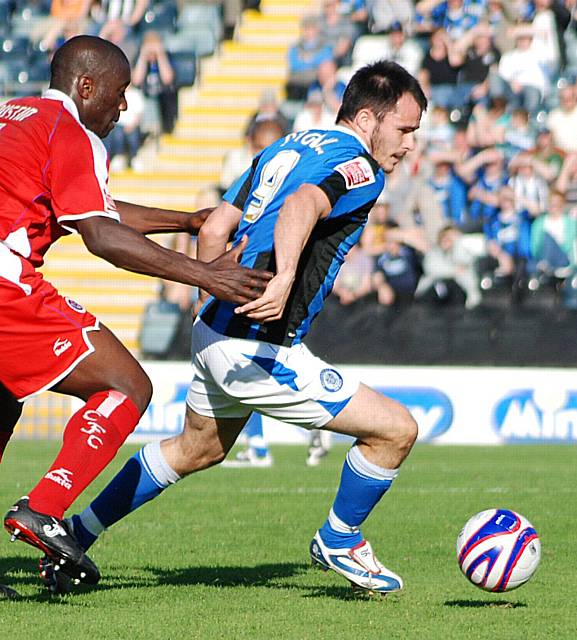 Chris Dagnall spins away from Kevin Austin.