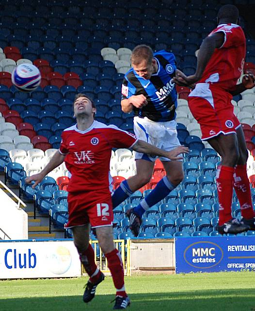 Rhodes gets a late header on target but Carson is able to save.