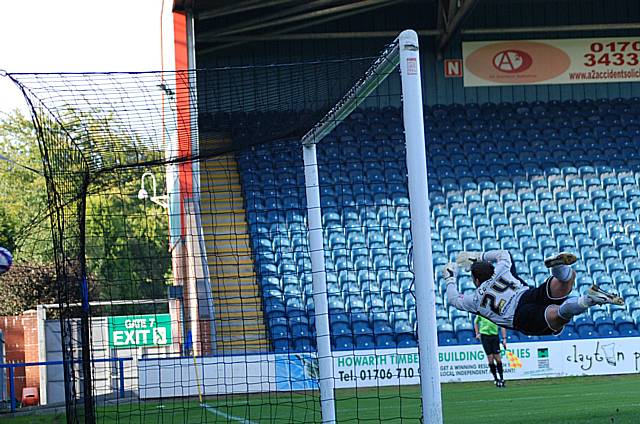 Kennedy's shot arrows into the back of the net.