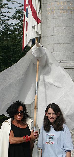 Nancy Dell'Olio holds a giant Peace Dove at the cenotaph.