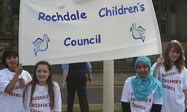 Members of Rochdale Children's Council with their peace banner.