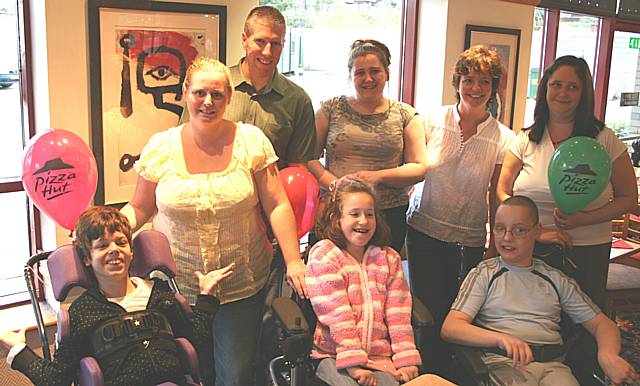 Youngsters and their carers from the Multilink short break scheme launch their new DVD at Pizza Hut, Rochdale.