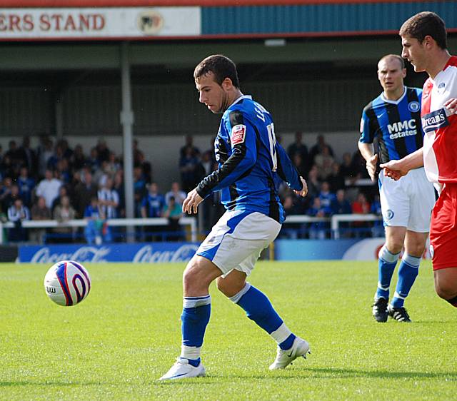 Le Fondre takes possession in front of John Mousinho