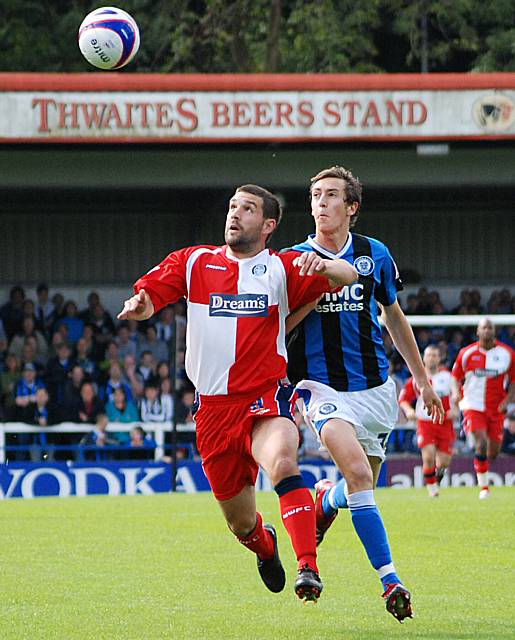 Tommy Doherty battles for posession with Buckley.