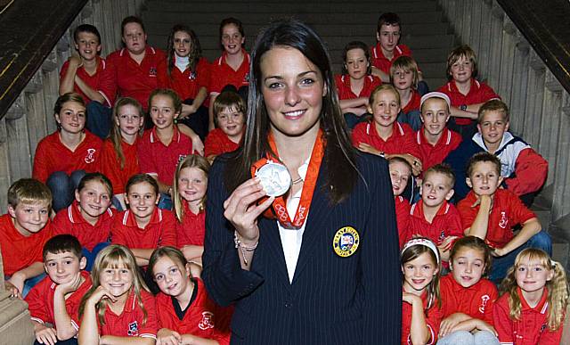 Keri-Anne Payne at the Town Hall with her Olympic silver medal and youngsters from the Aquabears swimming club.