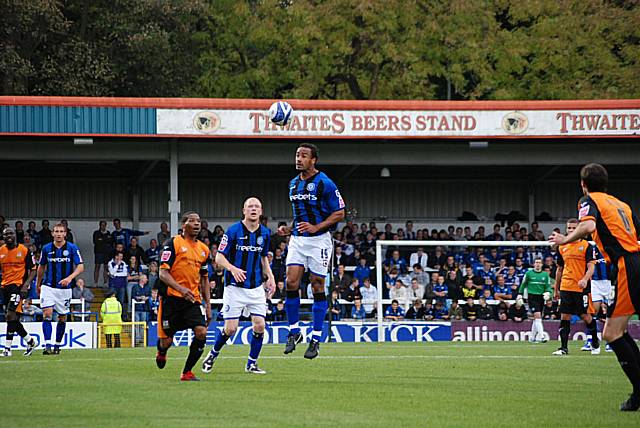 Chris O'Grady heads the ball on.