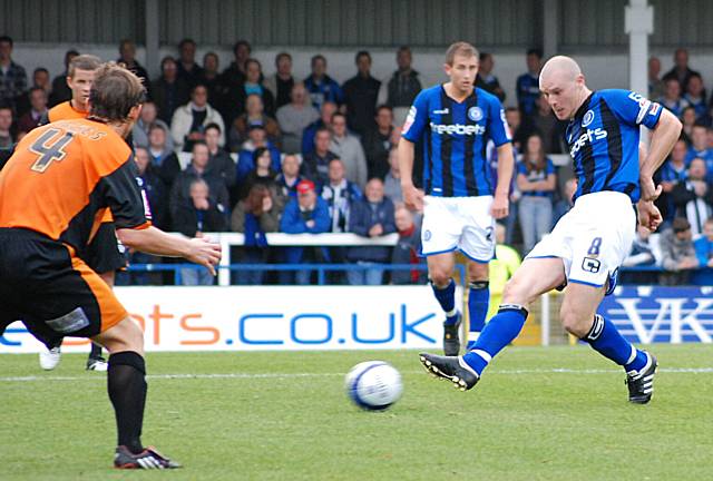 Gary Jones plays the ball out wide.