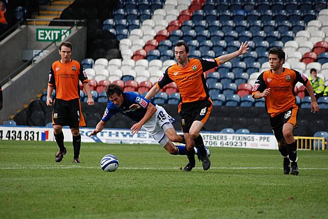 Buckley goes down under Breen's challenge and the referee awards Rochdale a penalty.