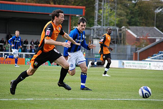 Chris Dagnall puts Gary Breen under pressure.