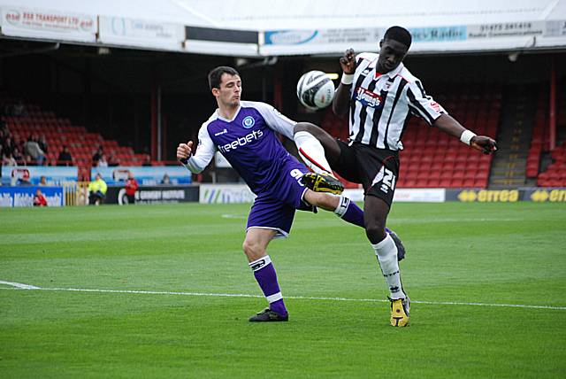 Arnaud Mendy gets ahead of Chris Dagnall before the Dale striker can pull the trigger.