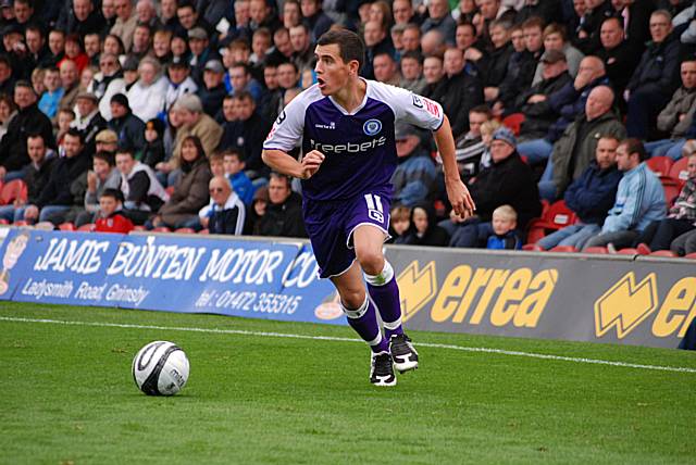 Adam Rundle prepares to put in a cross.