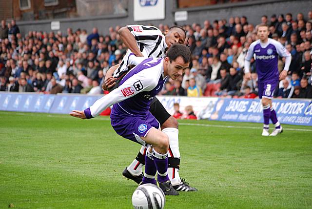 Chris Dagnall tangles with Jean Louis Akpro.