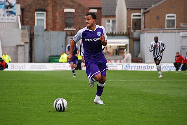 Simon Whaley looks for support as he bursts through the Grimsby backline.