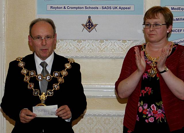 The Mayor and Mayoress of Rochdale, Councillor Keith Swift and Ms Susanne Etchells receiving a cheque for £700 from Rochdale Masons towards the Mayor's Charity.