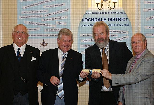 David Geldard & John Brown, from The British Heart Foundation, receiving their certificate from  Graham Rawlinson & David Ogden.