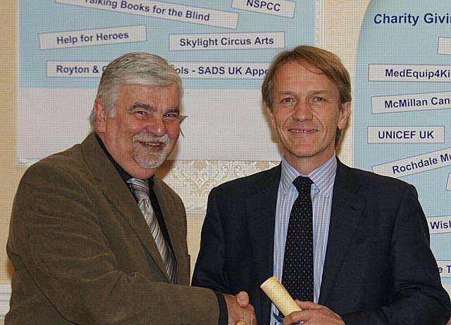 Prof. Noel Clarke (right) from The Christie Manchester Million Appeal thanking Ken Shay (left).