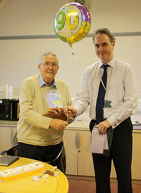 Ken Wilson receiving his celebration gift from Gareth Swarbrick, RBH Chief Executive.