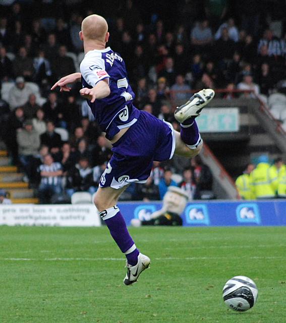 Jason Kennedy contorts himself in an attempt to control the ball!