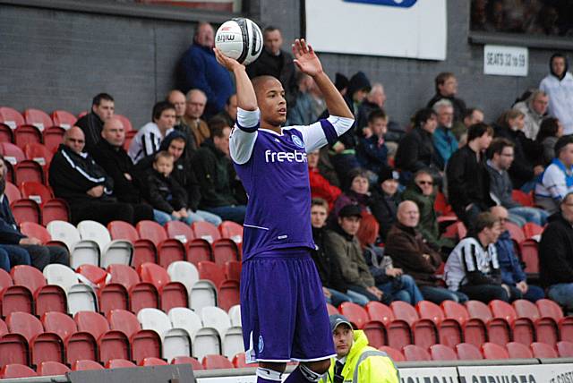 Joe Thompson prepares to take a Rochdale throw-in.