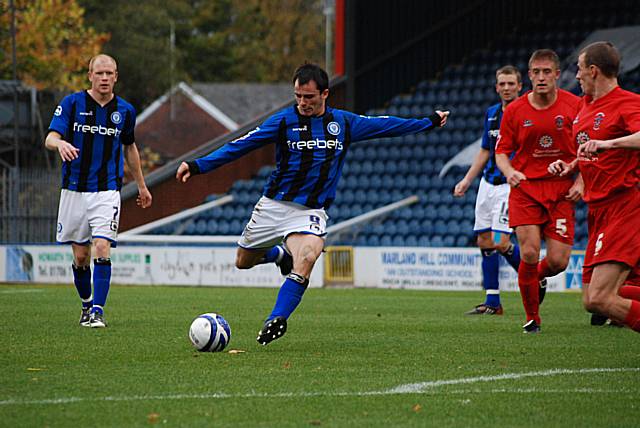 Dagnall fires in a shot from the edge of the box.