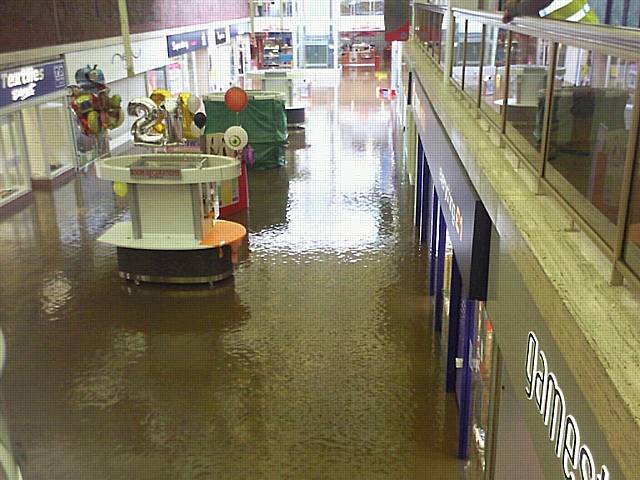 Flood water covers the floor of the Middleton Arndale shopping centre.