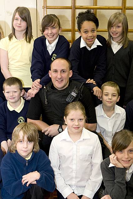 Police constable Rob Smith for the Middleton Neighbourhood Policing Team with pupils at St Gabriel’s CE Primary School.