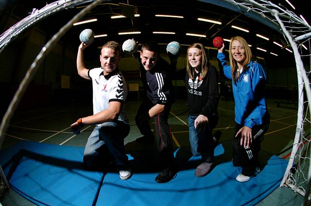 Going for goal: Ciaran Williams, Great Britain Handball captain, and Sue Whitehead, community sports manager at Siddal Moor High School, with 15 year olds Josh Campbell and Laura Hawkins. 