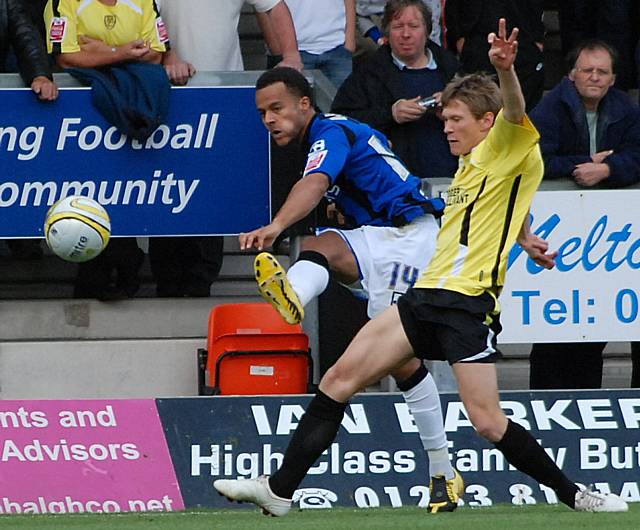 Simon Whaley fires the ball into the Burton box.