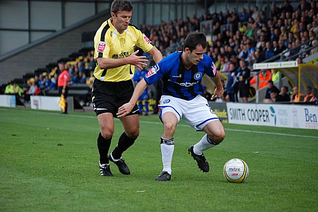 Chris Dagnall holds the ball away from Tony James.