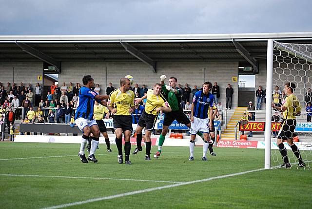 Artur Krysiak gets a fist to a Rochdale corner.