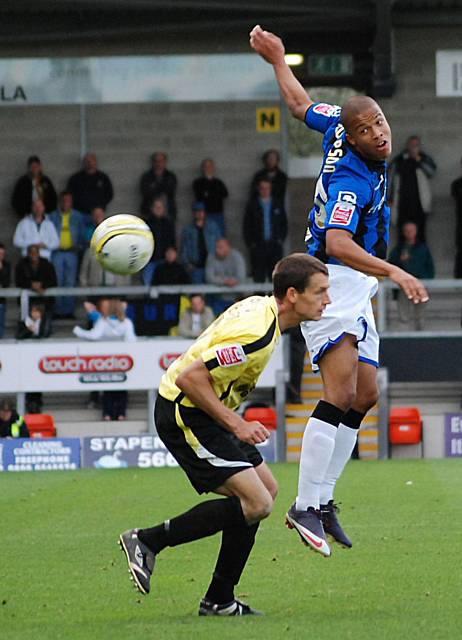 Joe Thompson nods the ball on.