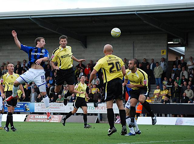 Scott Spencer aims a header towards goal.