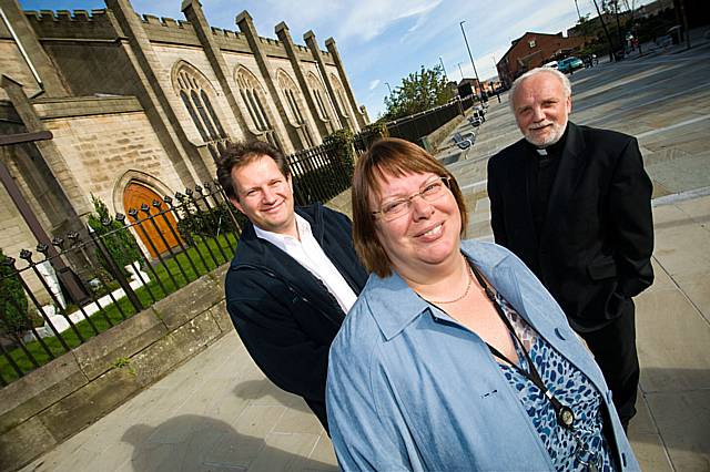 Father Ben with Alan Webster from the Impact Partnership and Janet Brooks of Rochdale Development Agency welcome the newlook public square at Townhead.