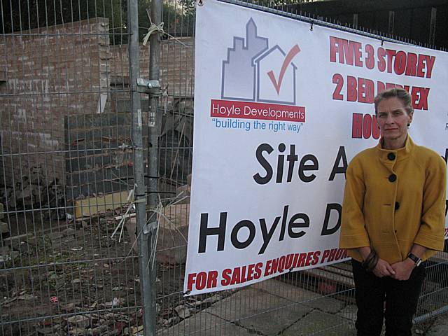 Wera Hobhouse at the site of the old Norden Fire Station, where Hoyle Developments have put up new signs pending their development of the site.