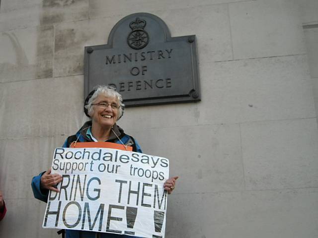 Peace Group member Rae Street holding a placard at the Ministry of Defence on Saturday 24 October 2009
