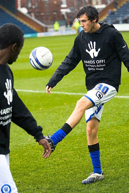 Midfielder Will Buckley, showing off his skills during his warm up wearing the Hands Off! branded t-shirt
