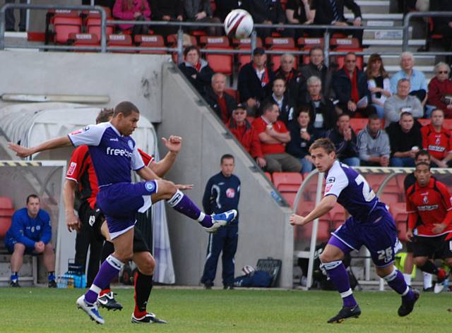 Nathan Stanton hooks the ball clear.