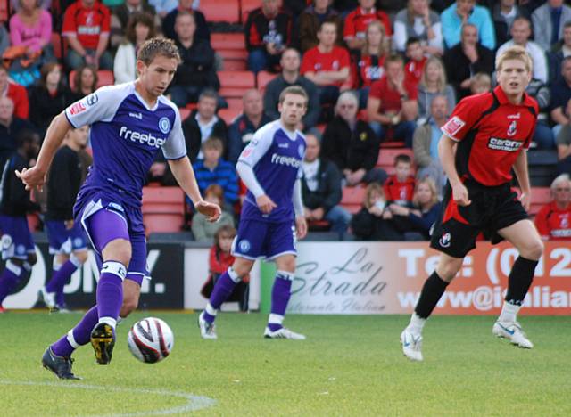 Craig Dawson takes control at the back for Rochdale.