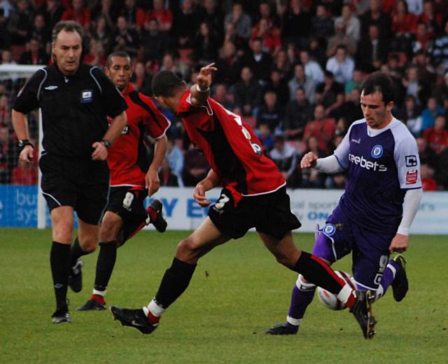 Dagnall takes on Anton Robinson in the build up to Rochdale's second goal.